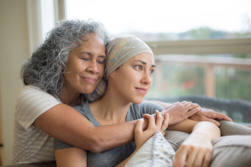 Cancer patient scarf friend family iStock 672689882 2