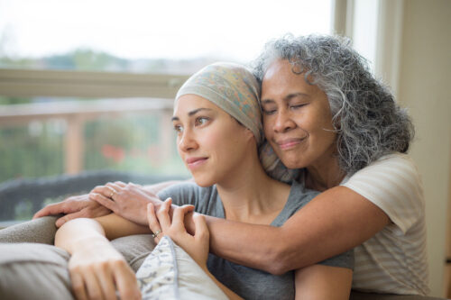 Cancer patient scarf friend family iStock 672689882