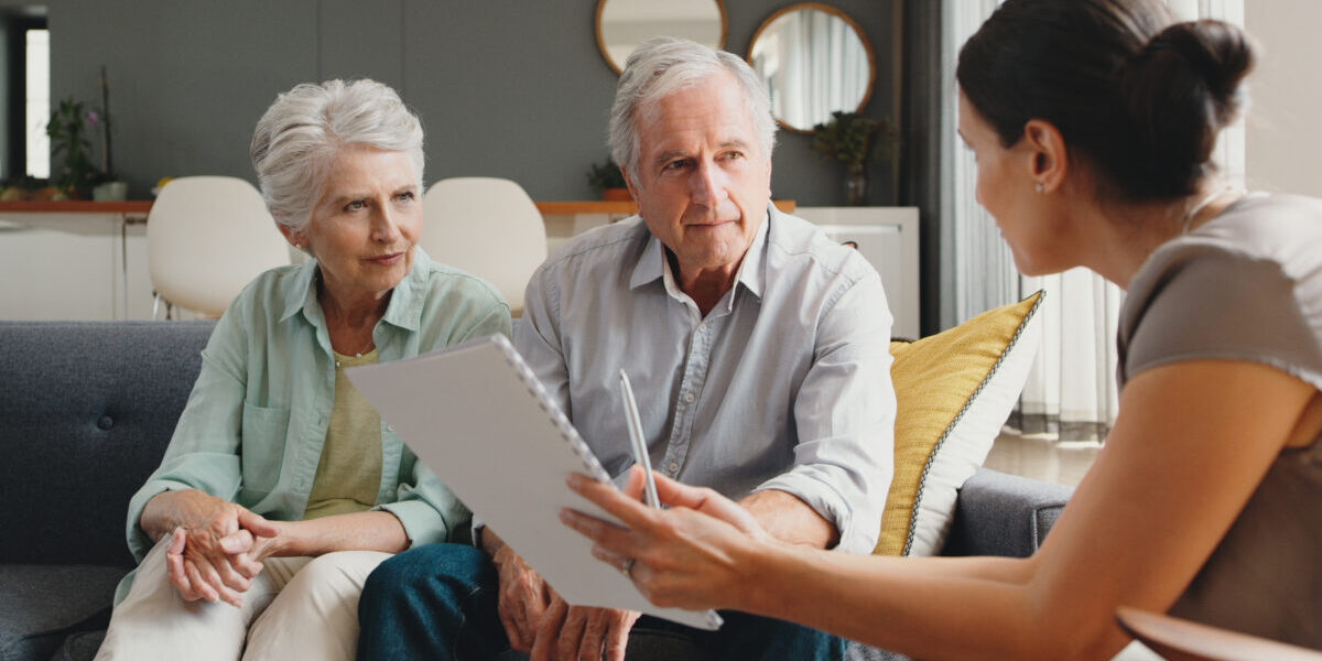 Senior couple consulting an independent advocate to review Medicare marketing messages and options