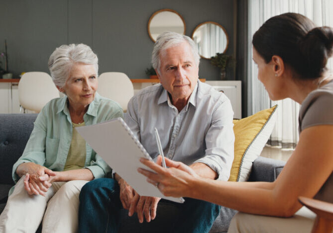 Senior couple consulting an independent advocate to review Medicare marketing messages and options