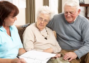 older clients discussing Medicare marketing messages and reviewing options